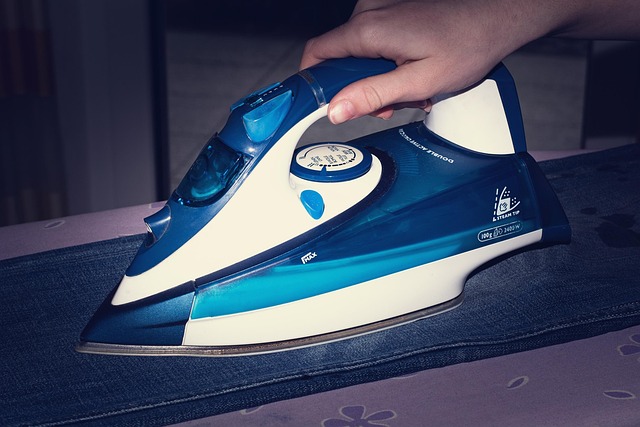 pressing fabric with iron on ironing board safe sewing practice
