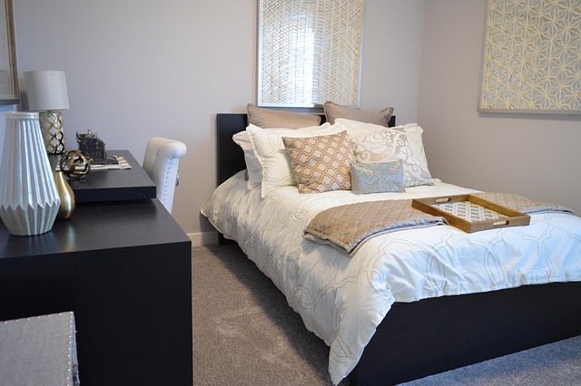cozy bedroom interior with layered bedding and warm neutral textiles