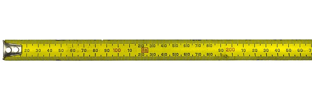 measuring fabric on cutting table with ruler rotary cutter calm workspace