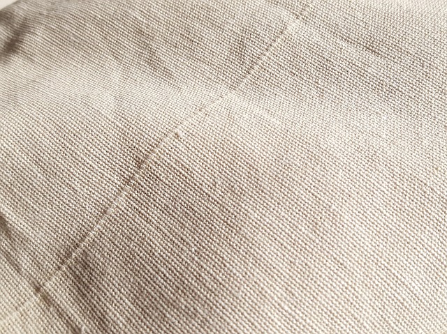 sewing studio with natural light fabric textures calm workspace